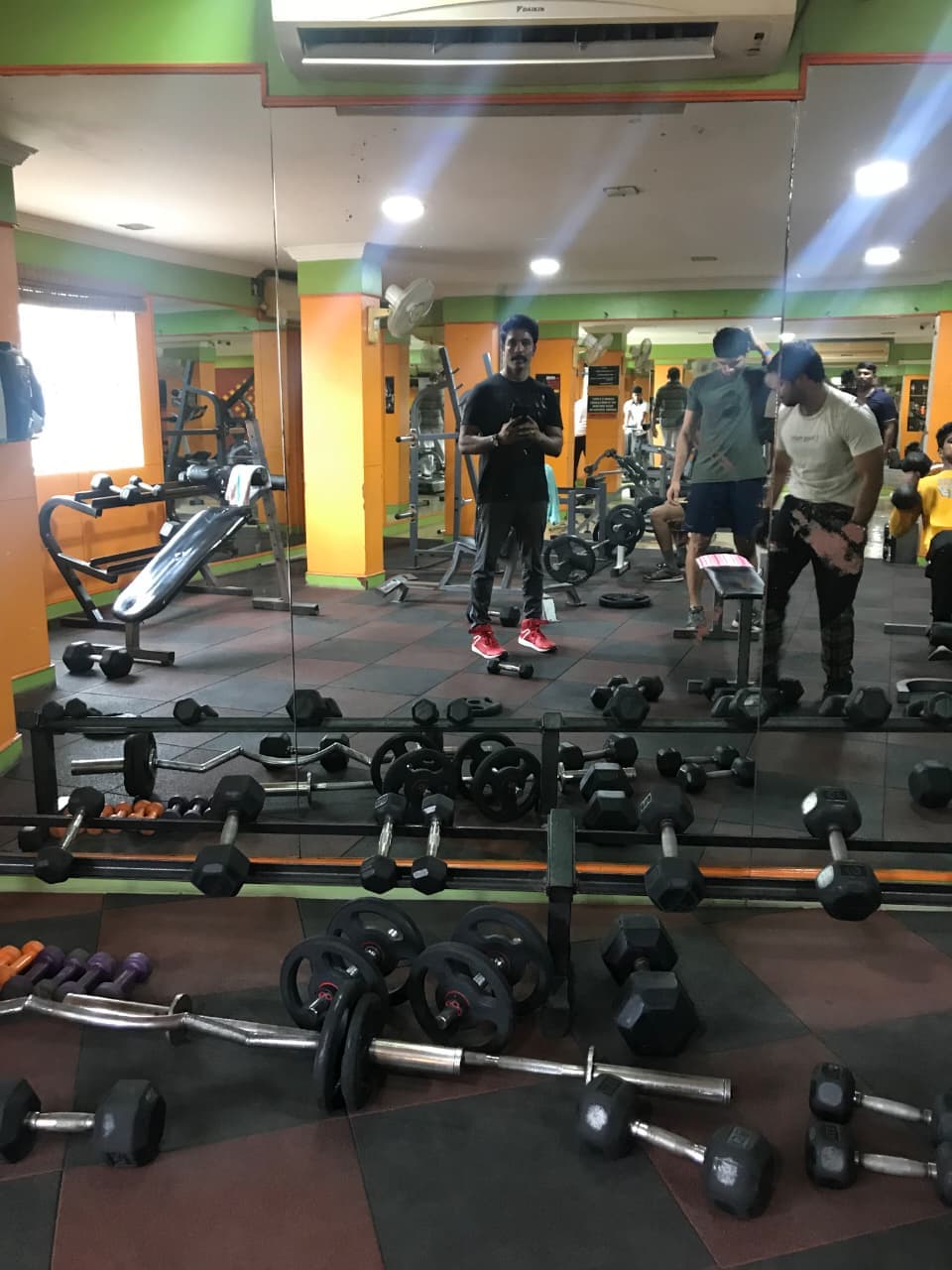 Member running on a treadmill in the cardio zone