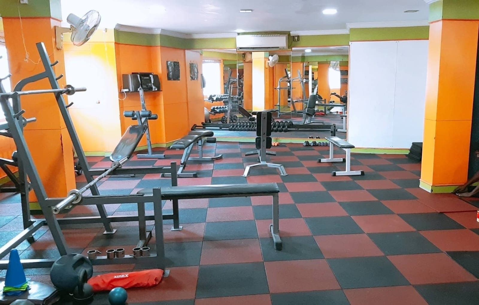 Members strength training on the main floor at Galaxy Fitness Mart